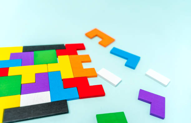 istock Geometric shapes of different shapes and colors. A developing constructor made of wood. Conceptual background and place for text 1311227822