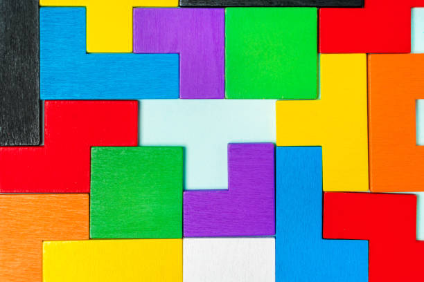 istock Geometric shapes of different shapes and colors. A developing constructor made of wood. Conceptual background and place for text 1311227835