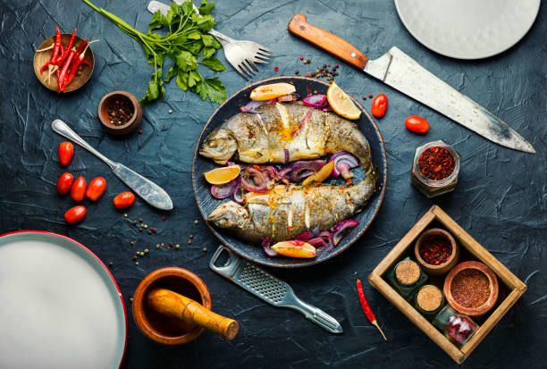 Baked trout with lemon,top view Roasted whole trout with lemon on plate.Delicious fried fish fish food stock pictures, royalty-free photos & images