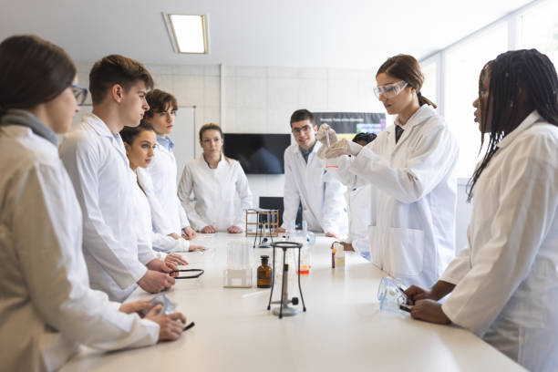 istock Group of High school students in chemistry class 1311230761