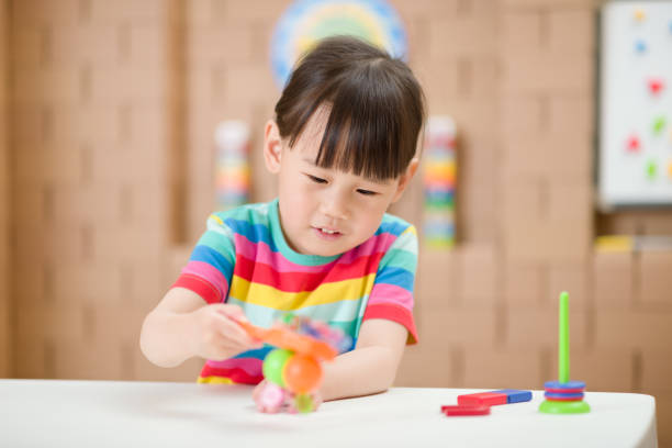 istock Young Girl Play Magical Magnet Experiments At Home For Homeschooling 1311232904