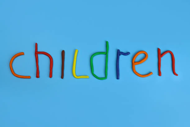 istock word children made of colored plasticine on a blue background 1311241441