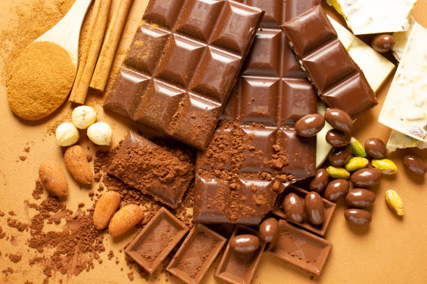 istock White and milk chocolates. Almond, pistachio, hazelnut.. background, texture.. 1311241739