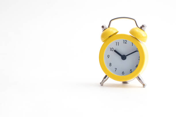 istock Yellow alarm clock with bell isolated on white background 1311242018