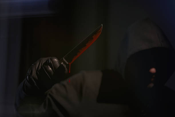 istock Man with a bloody knife 1311242240
