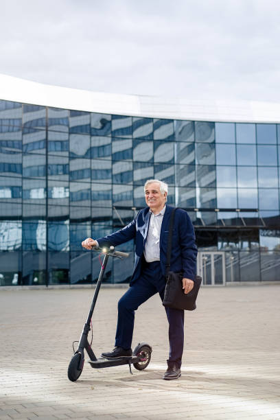 istock Businessman with his electric scooter 1311242929