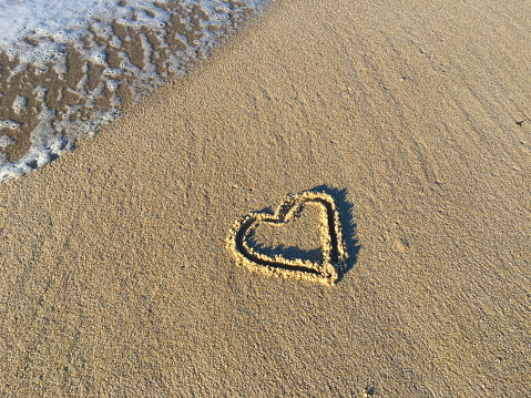 Heart painted in the sand, on the island of Sylt in the North Sea, Germany