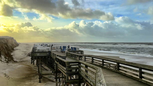 Windy on the beach Landscape view on the island of Sylt in the North Sea, Germany, here Kampen with storm north sea waves stock pictures, royalty-free photos & images
