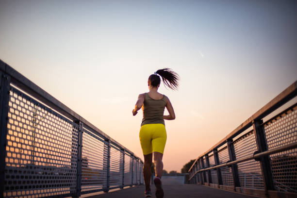 istock African woman jogging on the stairs. View from back. 1311250974