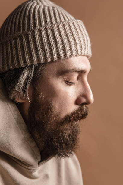 istock Close-up Caucasian mustached and bearded man in hat isolated on light background 1311253610