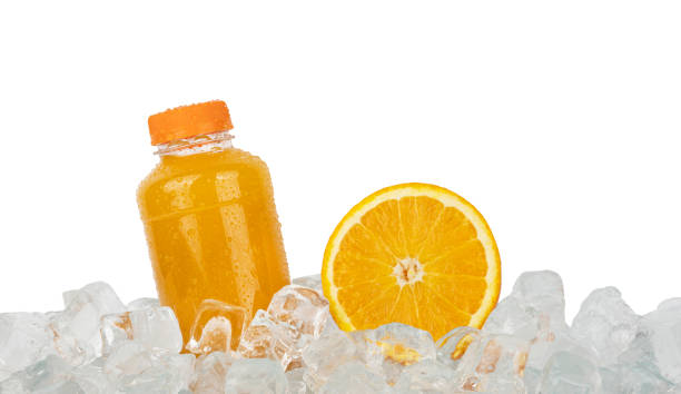 istock Fresh orange juice and cut slice on ice 1311255218