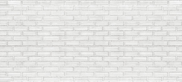 istock White brick wall texture background in rural room. 1311256203
