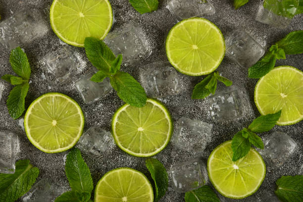 istock Flat lay of mint leaves, lime slices and ice cubes 1311256248