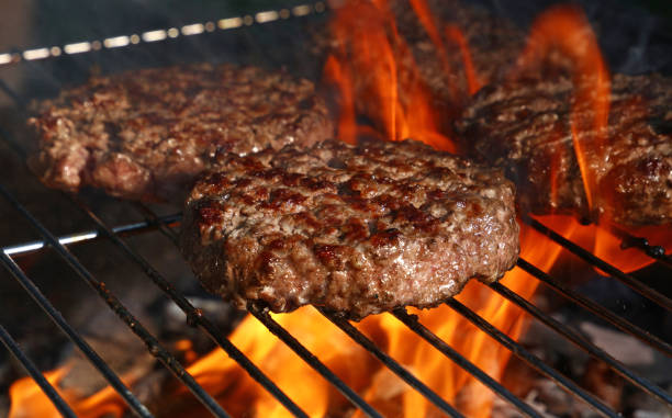 istock Beef burger for hamburger on barbecue flame grill 1311257553