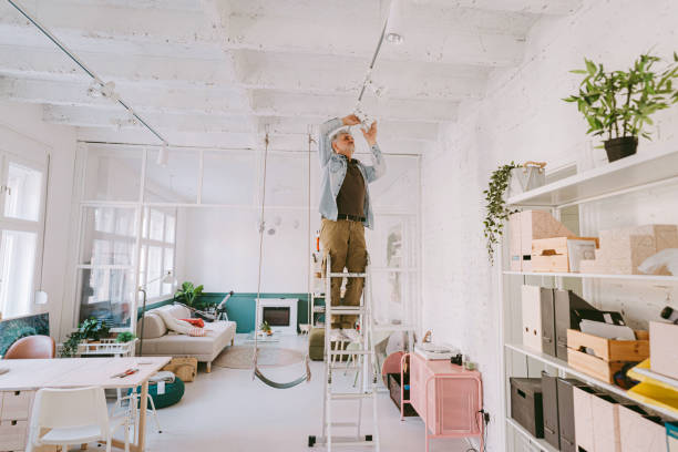 istock Mature man remodelling his home 1311261517