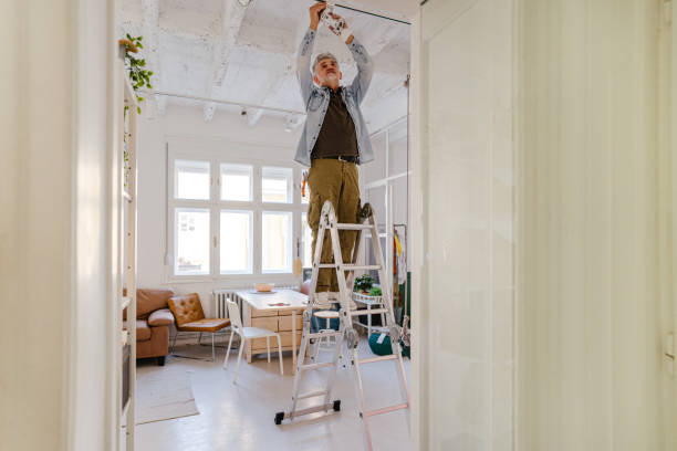 istock Mature man remodelling his home 1311261539