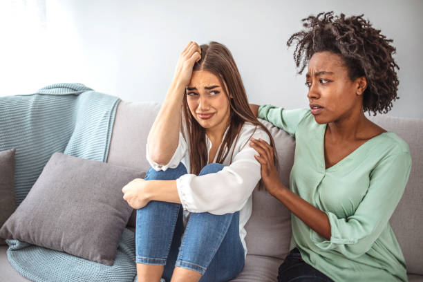 istock Two sad diverse women talking at home. 1311261551