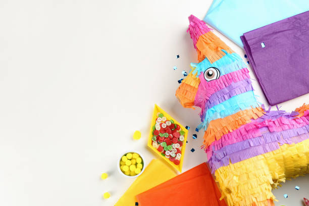 istock Flat lay composition with cardboard donkey and materials on white background, space for text. Pinata DIY 1311261967