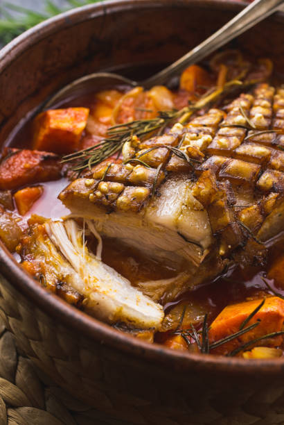 istock Roasted pork belly with vegetables and herbs 1311263683