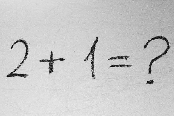 istock School teacher is drawn math formulas on the white chalkboard via black chalk. Back to school and education concepts 1311265297