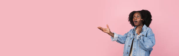 istock African-american woman portrait isolated on pink studio background with copyspace 1311265907