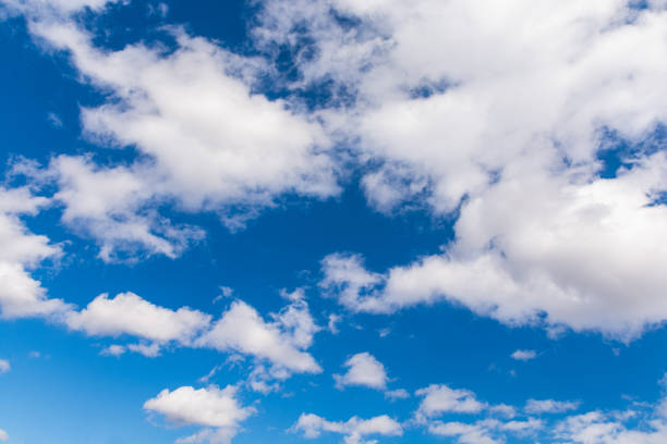 istock Fluffy heaping clouds on the blue sky in spring. Cirrus fluffy gentle clouds 1311266101