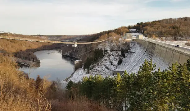View of the Rappode Dam with suspension bridge also known as Titan RT with dam and the river Bode in winter time