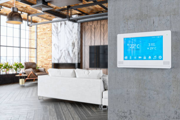 Smart Home Living Room Interior of a modern luxury house with smart automation system. thermostat stock pictures, royalty-free photos & images