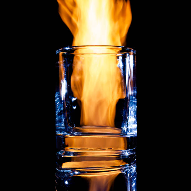 istock empty glass for strong alcohol on a black background 1311278868