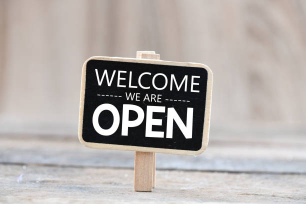 istock Welcome we are open words written on a chalkboard. 1311280311
