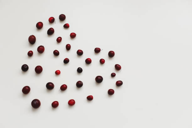 istock a heart made with fresh cranberries on white background 1311281451