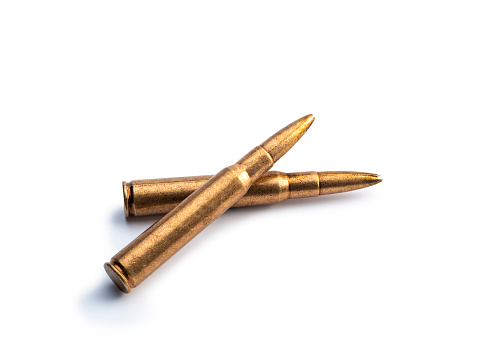 High angle view of two bullets on white