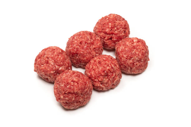 istock Raw meat balls isolated on white background. 1311286733