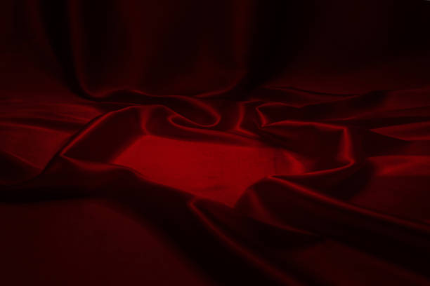 istock Red silk or satin luxury fabric texture can use as abstract background. 1311286821