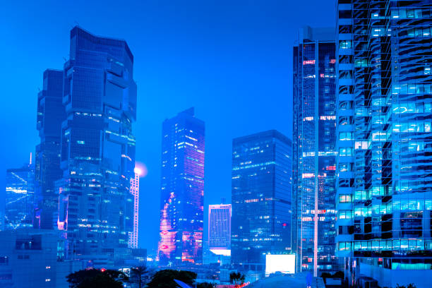 istock Modern office buildings in Hong Kong at night time 1311286860