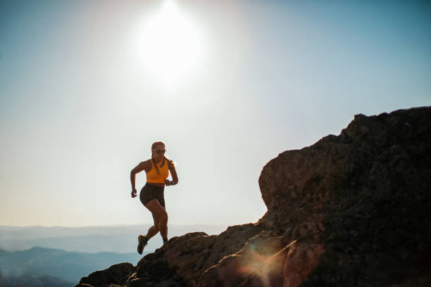 istock Woman running on mountain 1311288182