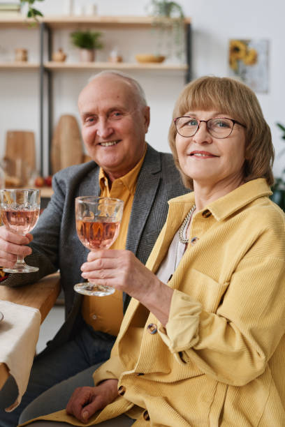 istock Senior couple with wine at dinner 1311289667