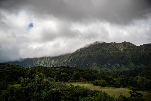 Dark storm clouds looming over the mountains in Oahu in Honolulu, HI, United States