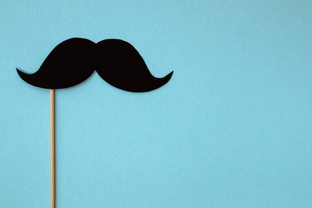 istock black mustache on blue background, happy father day 1311292176
