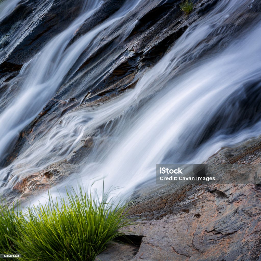 Smooth water long exposure in a waterfall with rocks and plants Smooth water long exposure in a waterfall with rocks and plants in Mondim de Basto, Vila Real District, Portugal Beauty Stock Photo