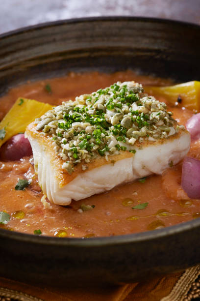 istock Pan Seared Halibut with Pumpkin Seed Gremolata with a Coconut Curry Sauce 1311293804