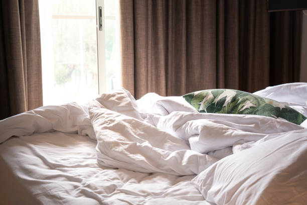 istock Messy blanket on bedding - Lazy Sunday. 1311295143
