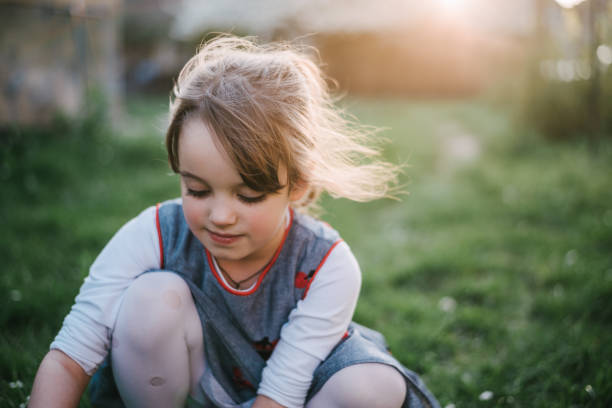 istock Young girl in a grass 1311295596