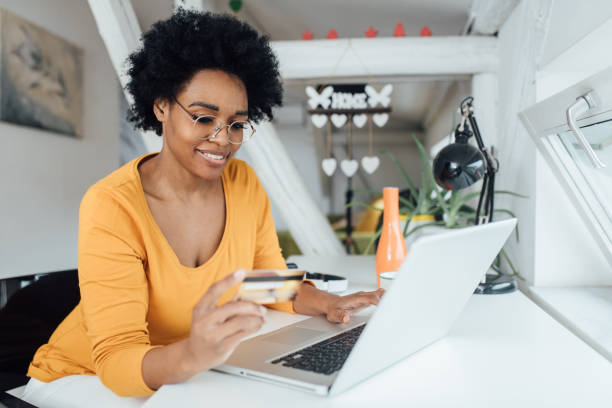 istock African American freelancer shopping online after work 1311297985