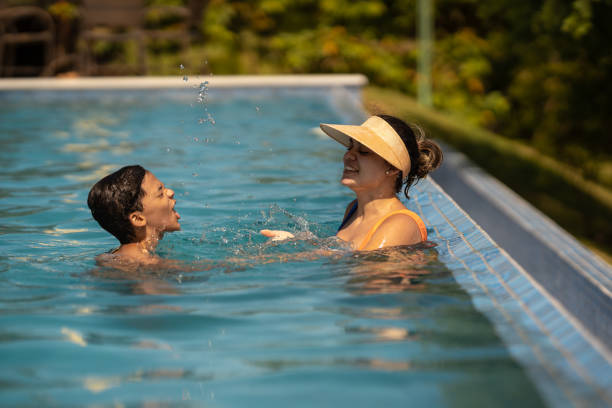 istock Mother and son at the pool party 1311299759