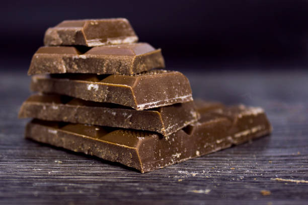 istock Chocolate Bars on wooden table top view 1311301207