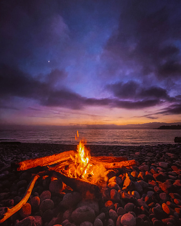 Purple sky with a beach fire