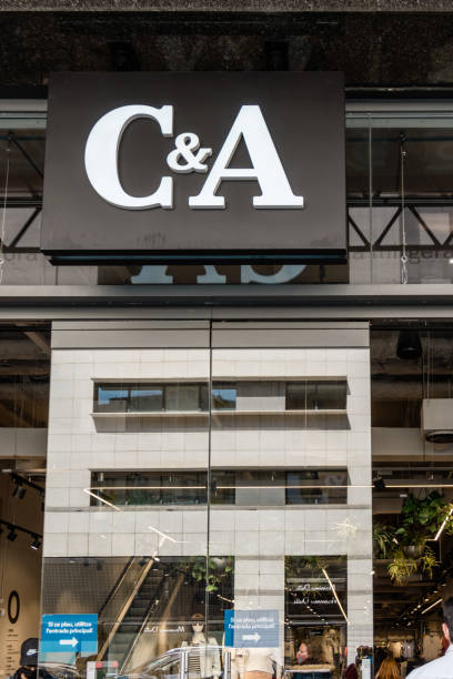 logo and facade of c&a, an international chain of clothing businesses. arises in sneek, the netherlands in 1841 - store street barcelona shopping mall imagens e fotografias de stock