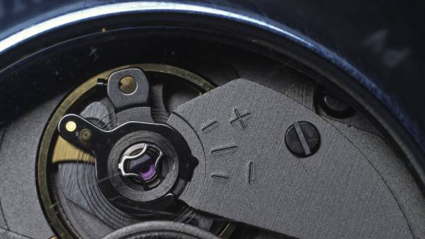 istock Watch mechanism macro loop. Old vintage clock mechanism working, closeup shot with soft focus. Close up of a internal clock mechanism. 1311303515