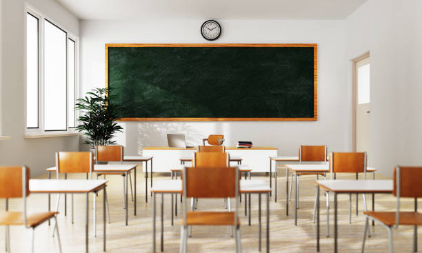 istock Empty white classroom background with green chalkboard table and seat on wooden floor. Education and Back to school concept. Architecture interior. Social distancing theme. 3D illustration rendering 1311307735